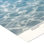 Close-up of water surface with a sheet of Classic Semi-Glossy Paper partially covering it.